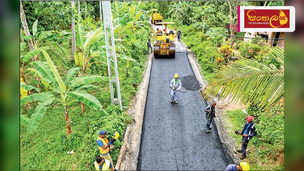 වයඹ ග්රාමීය මාර්ග සංවර්ධනයට නව ‘සිමෙන්ති ස්ථායීකරණ’ ක්රමවේදයක් Headline: වයඹ ග්රාමීය මාර්ග සංවර්ධනයට නව 'සිමෙන්ති ස්ථායීකරණ' ක්රමවේදයක් Intended image subject: Road construction site in North Western Province Story summary: වයඹ පළාතේ ග්රාමී
