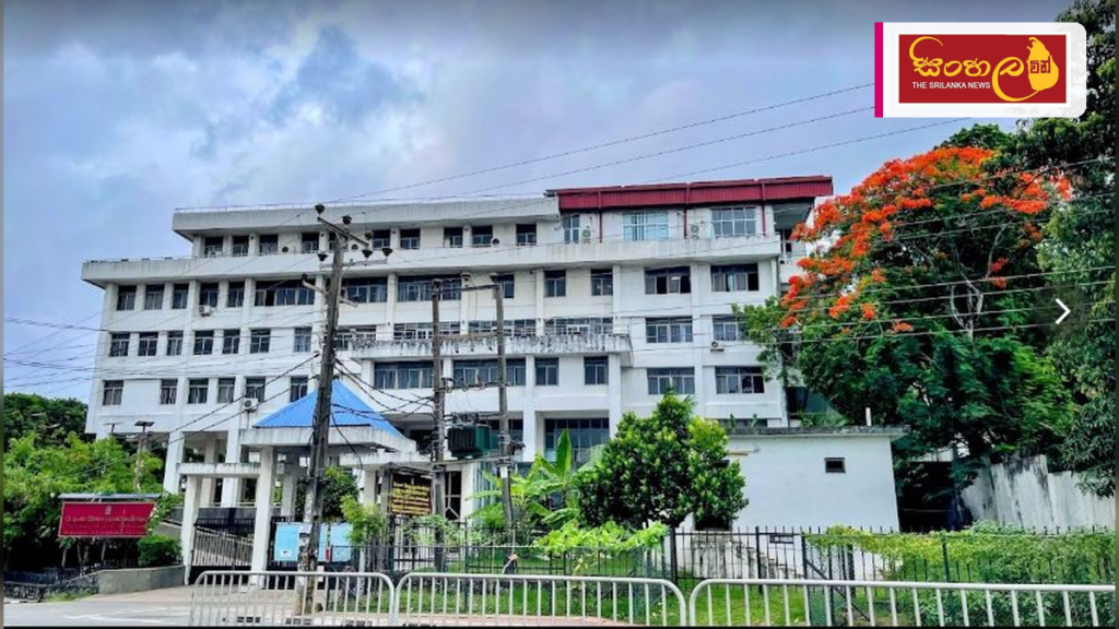 2026 උසස් පෙළ ප්රායෝගික පරීක්ෂණ සඳහා ප්රවේශ පත්ර නිකුත් කෙරේ Headline: 2026 උසස් පෙළ ප්රායෝගික පරීක්ෂණ සඳහා ප්රවේශ පත්ර නිකුත් කෙරේ Intended image subject: Department of Examinations Sri Lanka building Story summary: 2026 අ.පො.ස. උසස් පෙළ