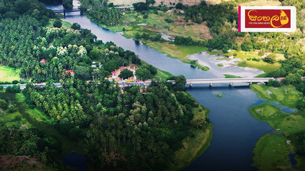 Headline: ප්‍රධාන ගංගාවල ජල මට්ටම යථා තත්ත්වයට Intended image subject: Aerial view of a river in Sri Lanka Story summary: දිවයින පුරා පවතින ප්‍රධාන ගංගා සහ ජලාශවල ජල මට්ටම ක්‍රමයෙන